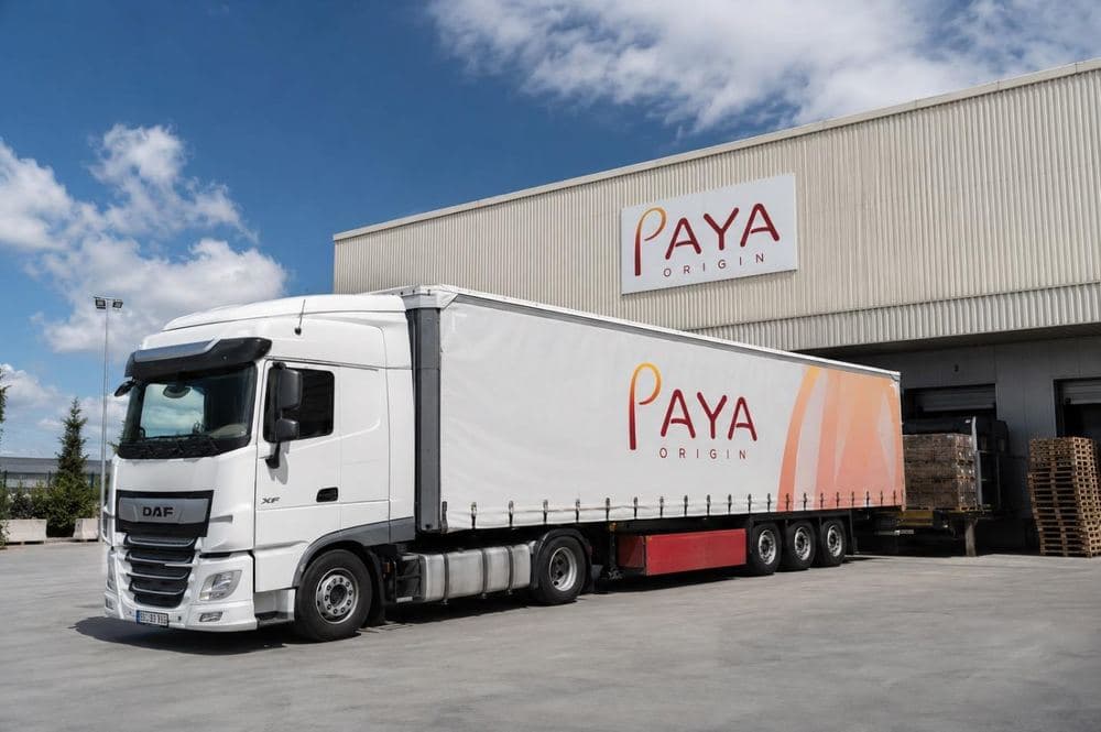A PAYA ORIGIN branded truck outside the company's warehouse